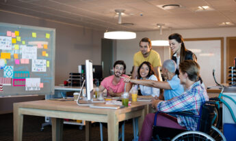 Group of different persons working in teams