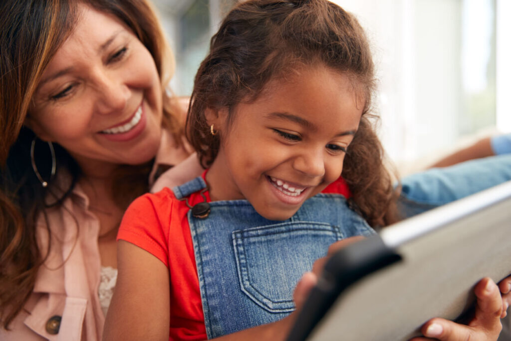 Daughter and mother learning with technology