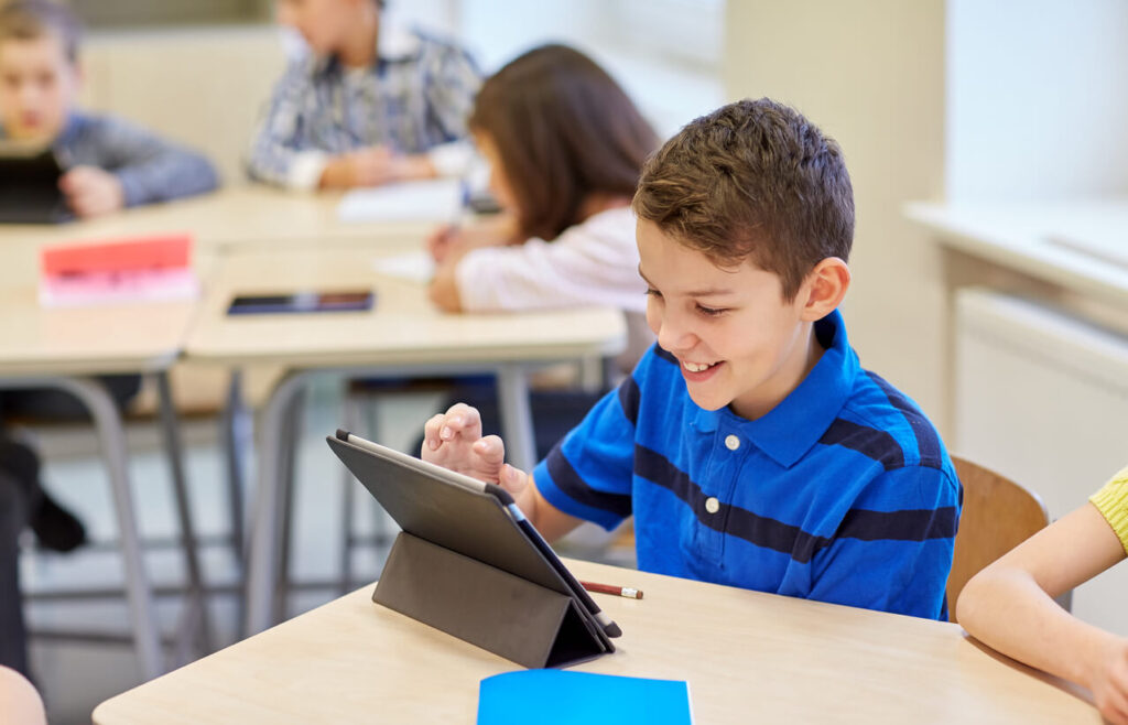 Kid learning through his electronic device