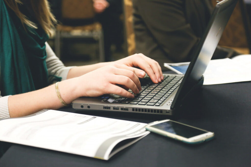 person typing on a keyboard trying to learn