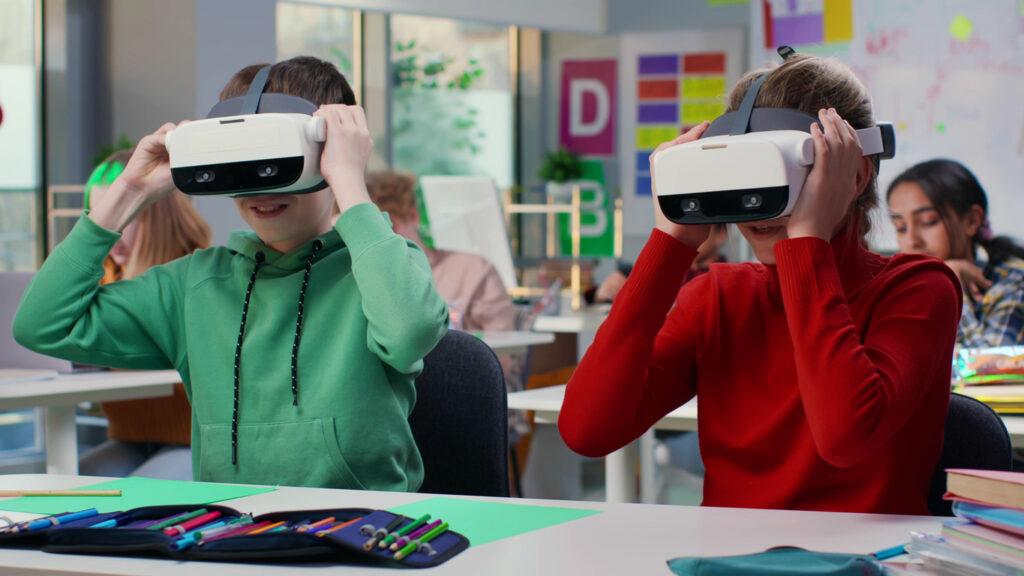 Young students in a classroom using VR technology.