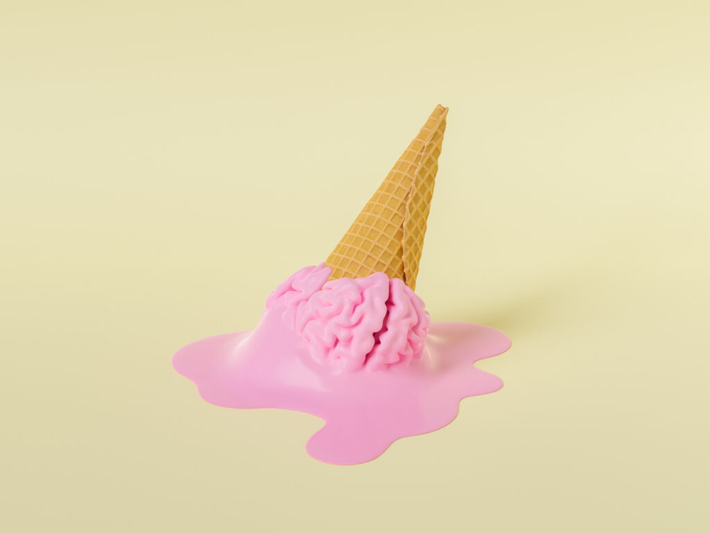 pink melted gelato in the form of a human brain in a waffle cone fell on beige surface